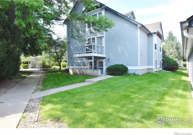1601 W Swallow Rd Unit D, Fort Collins, CO 80526 - view of side of property featuring a lawn