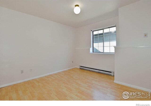 1601 W Swallow Rd Unit D, Fort Collins, CO 80526 - unfurnished room featuring baseboard heating and wood finished floors