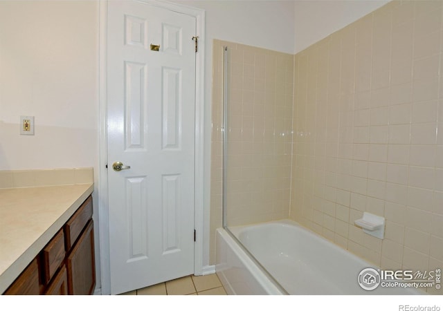 1601 W Swallow Rd Unit D, Fort Collins, CO 80526 - bathroom featuring tile patterned floors, vanity, and bathing tub / shower combination