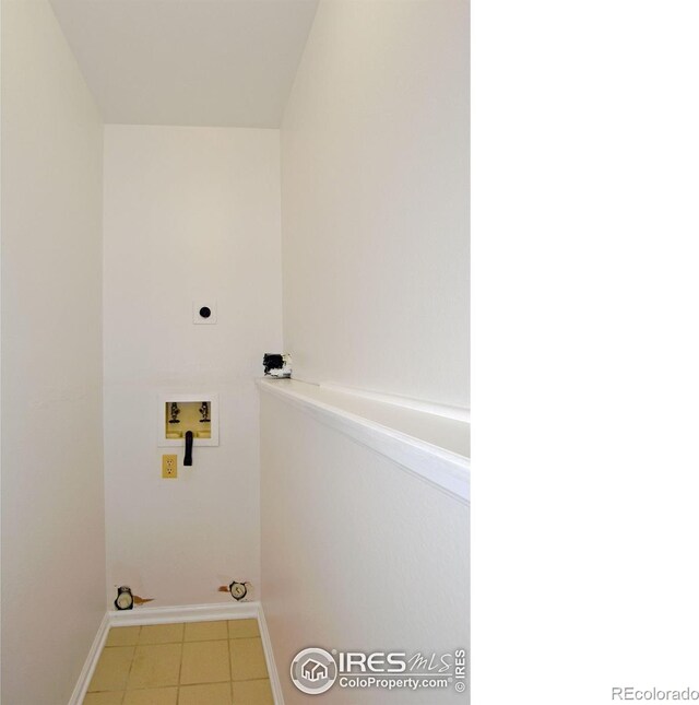 1601 W Swallow Rd Unit D, Fort Collins, CO 80526 - washroom featuring washer hookup, hookup for an electric dryer, and tile patterned flooring