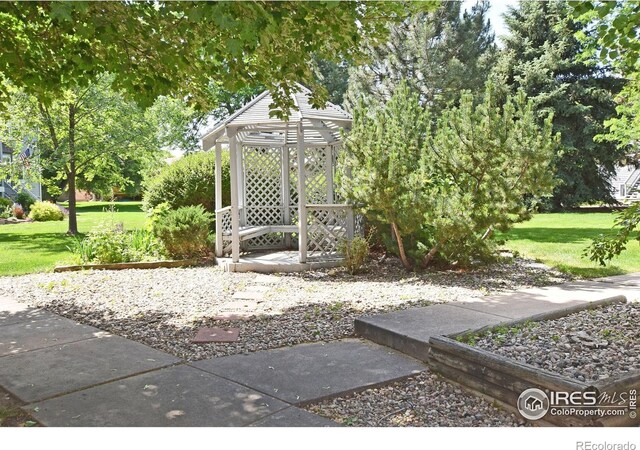 1601 W Swallow Rd Unit D, Fort Collins, CO 80526 - view of grassy yard with a gazebo