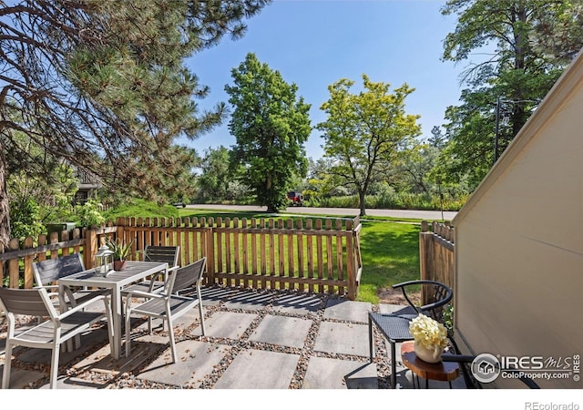 4863 W Moorhead Cir, Boulder, CO 80305 - wooden terrace featuring outdoor dining space and a patio area