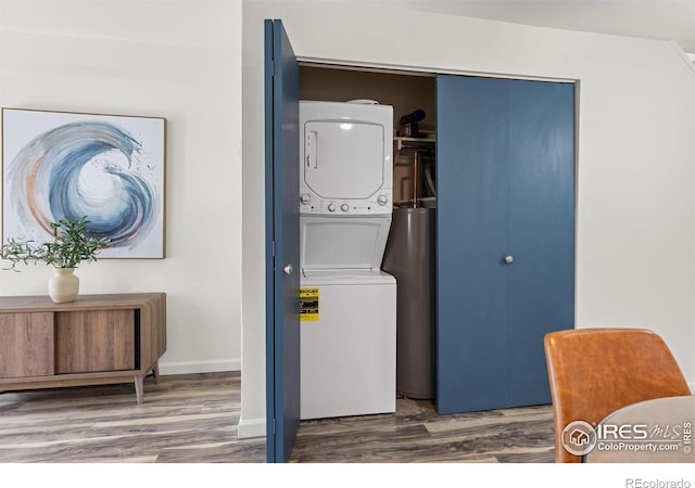 4863 W Moorhead Cir, Boulder, CO 80305 - laundry room featuring stacked washer / drying machine and wood finished floors