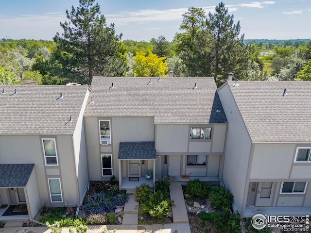 4863 W Moorhead Cir, Boulder, CO 80305 - view of front facade with a shingled roof and covered porch