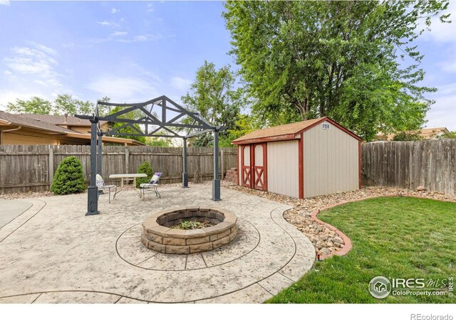 3207 Valmont St, Evans, CO 80620 - fenced backyard with a fire pit, a patio area, and a storage shed