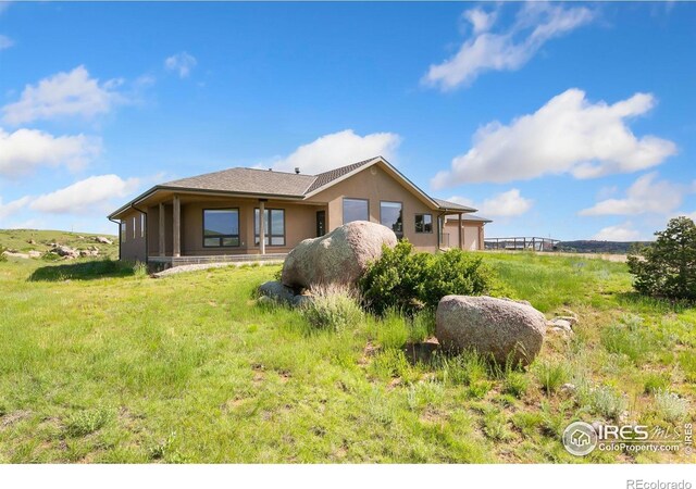102 Bear Hollow Rd, Laporte, CO 80535 - rear view of house featuring stucco siding