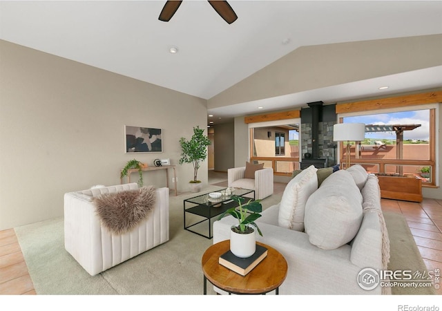 102 Bear Hollow Rd, Laporte, CO 80535 - living area featuring vaulted ceiling, a wood stove, ceiling fan, tile patterned floors, and recessed lighting