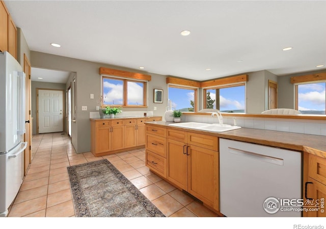 102 Bear Hollow Rd, Laporte, CO 80535 - kitchen featuring white appliances, recessed lighting, light tile patterned floors, and light countertops