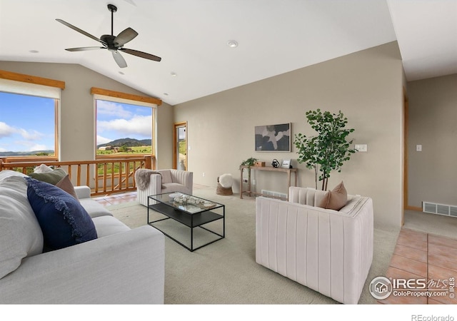 102 Bear Hollow Rd, Laporte, CO 80535 - carpeted living area featuring plenty of natural light, vaulted ceiling, and a ceiling fan