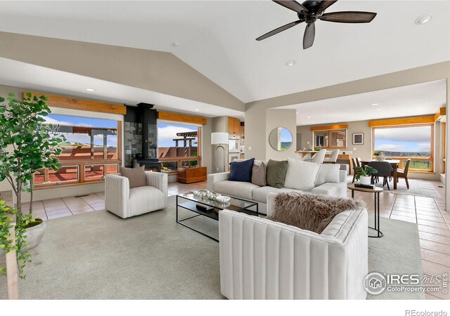 102 Bear Hollow Rd, Laporte, CO 80535 - living room with a wood stove, lofted ceiling, ceiling fan, recessed lighting, and tile patterned flooring