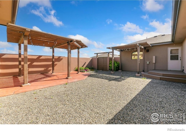 102 Bear Hollow Rd, Laporte, CO 80535 - fenced backyard with a pergola, a patio, and a shed