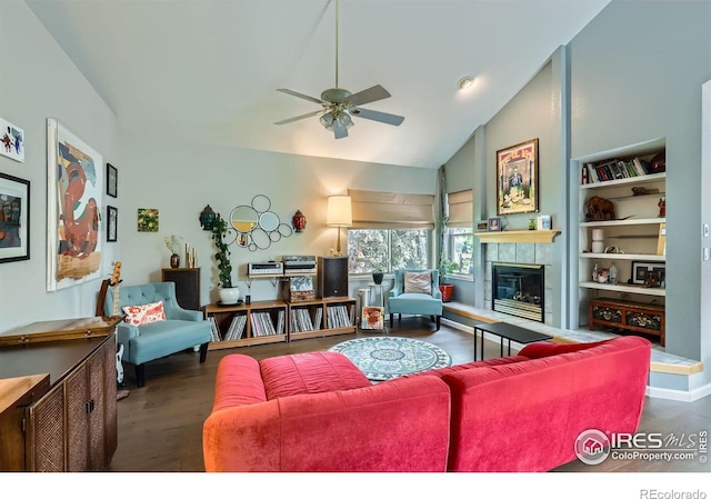 7196 Christopher Ct, Niwot, CO 80503 - living room with a ceiling fan, wood finished floors, vaulted ceiling, and a tiled fireplace