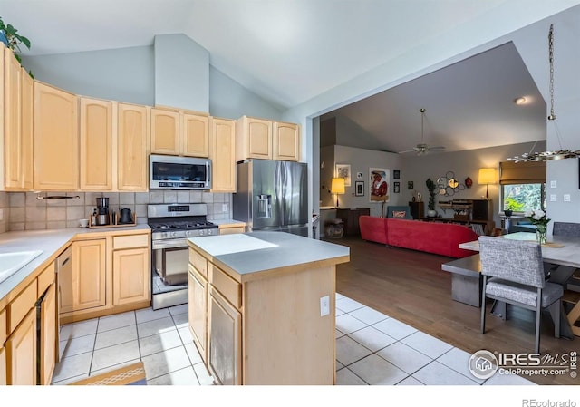 7196 Christopher Ct, Niwot, CO 80503 - kitchen with appliances with stainless steel finishes, light brown cabinets, ceiling fan, light countertops, and high vaulted ceiling