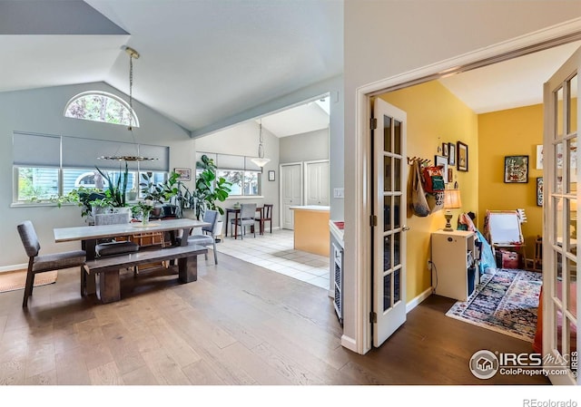 7196 Christopher Ct, Niwot, CO 80503 - dining area with lofted ceiling, wood finished floors, and french doors