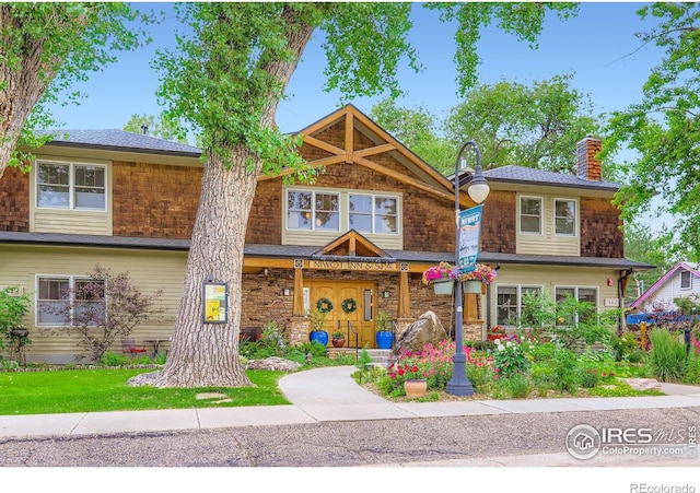 7196 Christopher Ct, Niwot, CO 80503 - view of front of house with a chimney and stone siding