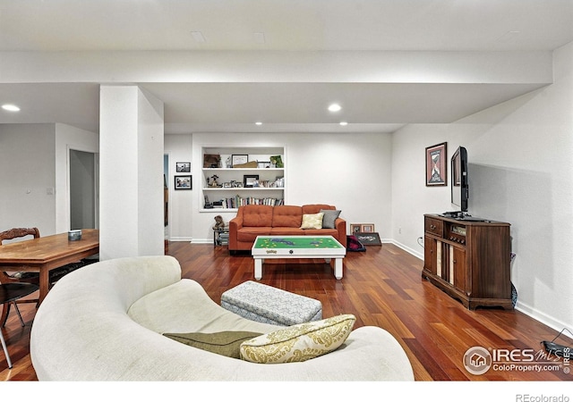 7196 Christopher Ct, Niwot, CO 80503 - living room with wood finished floors, recessed lighting, and built in shelves