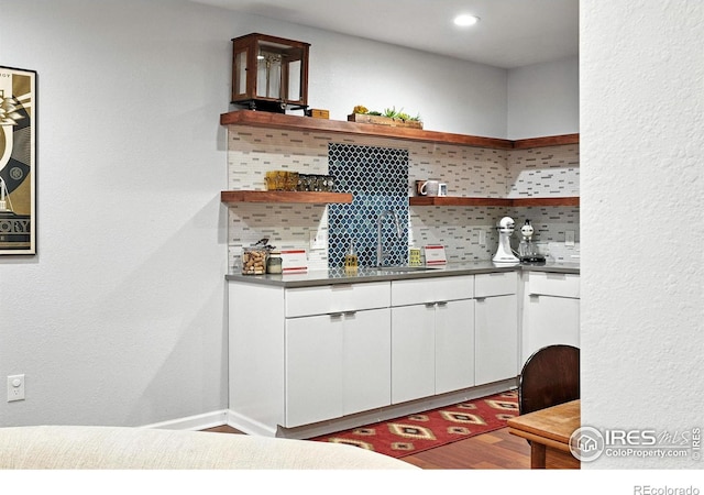 7196 Christopher Ct, Niwot, CO 80503 - indoor bar with tasteful backsplash, wood finished floors, and recessed lighting