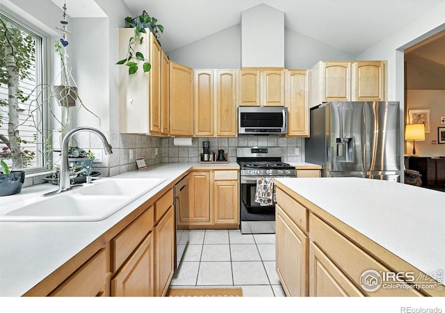 7196 Christopher Ct, Niwot, CO 80503 - kitchen featuring stainless steel appliances, light brown cabinetry, light countertops, tasteful backsplash, and light tile patterned floors