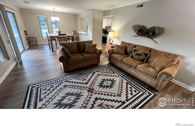 1141 Fairway Club Cir # C3, Estes Park, CO 80517 - living area with wood finished floors and baseboards