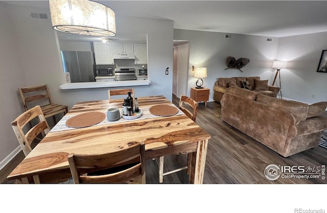 1141 Fairway Club Cir # C3, Estes Park, CO 80517 - dining room with dark wood finished floors and baseboards