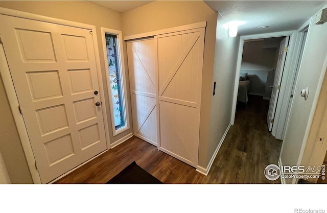 1141 Fairway Club Cir # C3, Estes Park, CO 80517 - foyer with dark wood-style flooring and baseboards