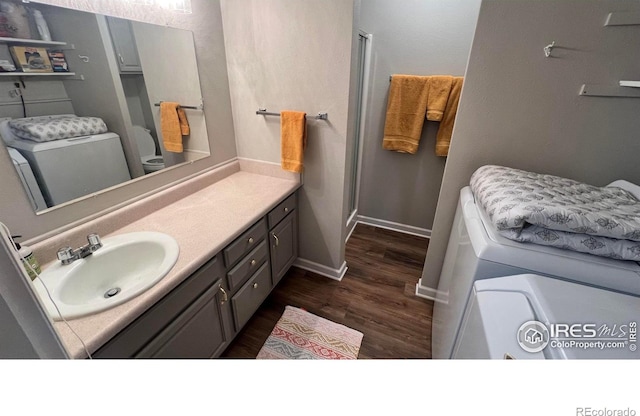 1141 Fairway Club Cir # C3, Estes Park, CO 80517 - bathroom with wood finished floors, vanity, a stall shower, and washer / clothes dryer