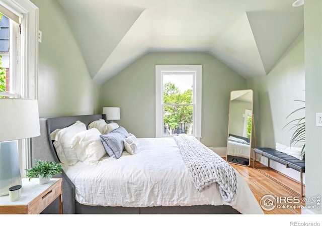 2025 18th St, Boulder, CO 80302 - bedroom featuring wood finished floors and vaulted ceiling