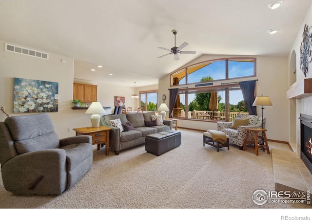2156 Meander Rd, Windsor, CO 80550 - living area featuring a fireplace with flush hearth, a ceiling fan, light carpet, lofted ceiling, and recessed lighting