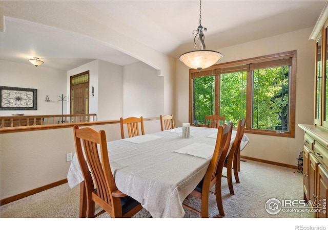 2156 Meander Rd, Windsor, CO 80550 - dining area featuring light colored carpet and arched walkways