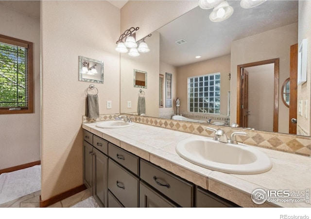 2156 Meander Rd, Windsor, CO 80550 - full bathroom with double vanity and baseboards