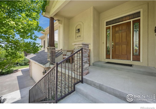 2156 Meander Rd, Windsor, CO 80550 - property entrance with stone siding and stucco siding