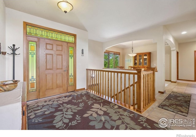 2156 Meander Rd, Windsor, CO 80550 - foyer with arched walkways and tile patterned flooring