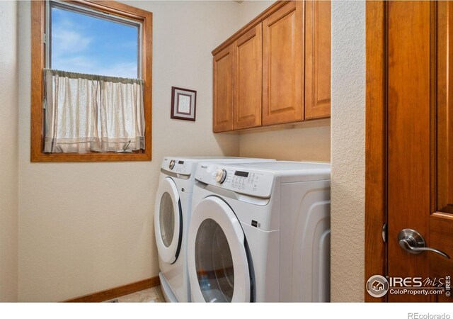2156 Meander Rd, Windsor, CO 80550 - laundry area with washing machine and clothes dryer and cabinet space