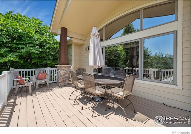 2156 Meander Rd, Windsor, CO 80550 - wooden terrace featuring outdoor dining area