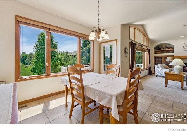 2156 Meander Rd, Windsor, CO 80550 - dining room with built in features, healthy amount of natural light, a chandelier, lofted ceiling, and light tile patterned flooring