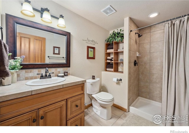 2156 Meander Rd, Windsor, CO 80550 - bathroom featuring vanity, tile patterned flooring, and a tile shower