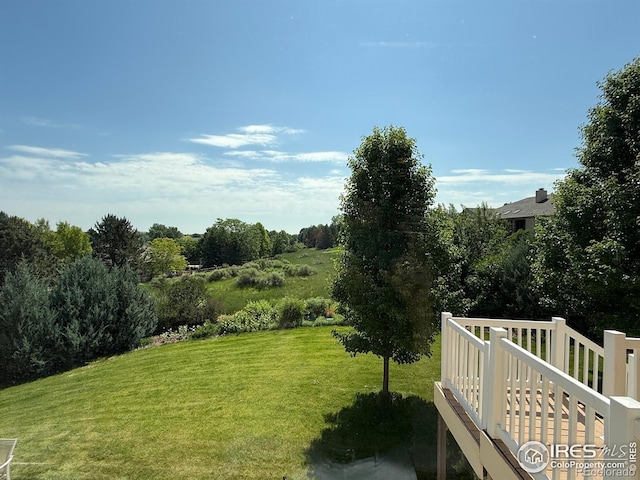 2156 Meander Rd, Windsor, CO 80550 - view of green lawn with a wooden deck
