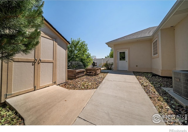 137 Reid Rd, Fort Morgan, CO 80701 - view of patio / terrace with a shed and a vegetable garden