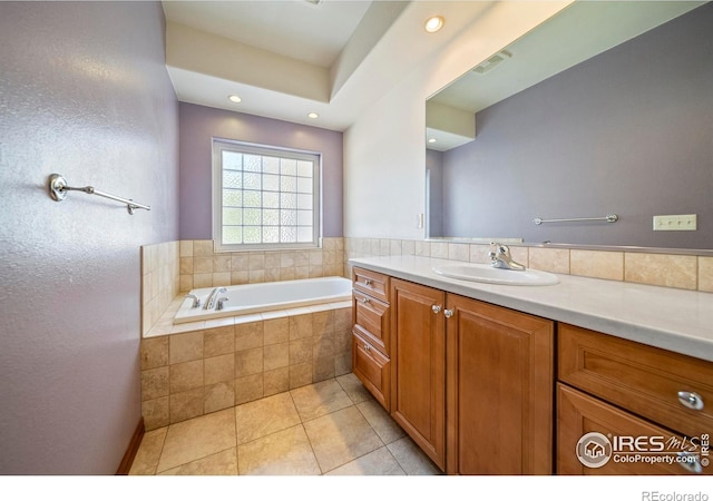 137 Reid Rd, Fort Morgan, CO 80701 - full bathroom featuring vanity, a bath, tile patterned floors, and recessed lighting
