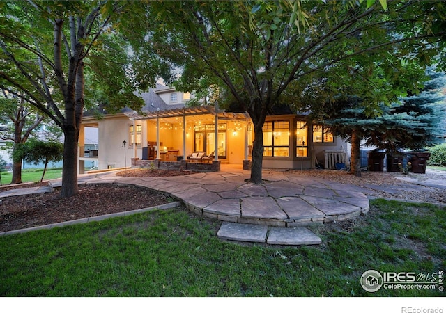 5424 Taylor Ln, Fort Collins, CO 80528 - rear view of house with a patio, stucco siding, a pergola, and a lawn