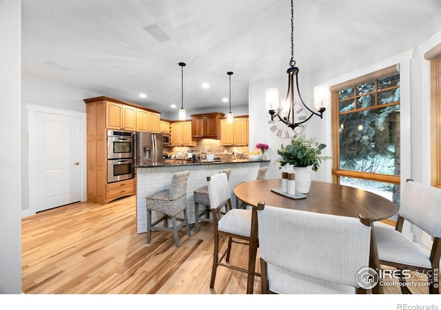 5424 Taylor Ln, Fort Collins, CO 80528 - dining area featuring light wood-style flooring, recessed lighting, and a chandelier