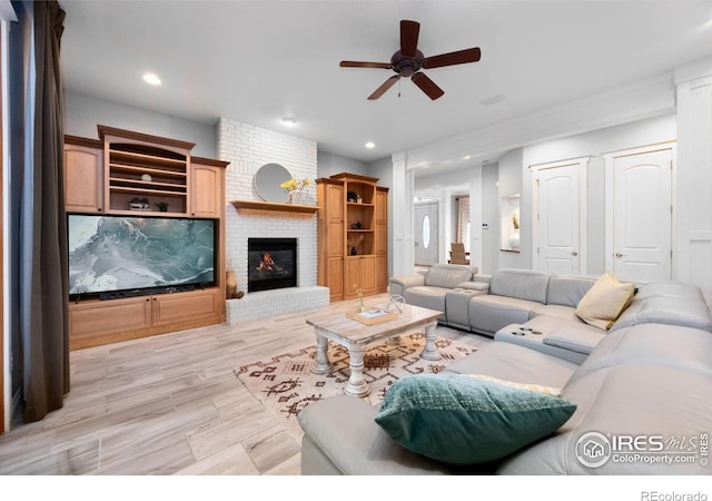 5424 Taylor Ln, Fort Collins, CO 80528 - living room featuring a ceiling fan, a brick fireplace, recessed lighting, and light wood-style flooring