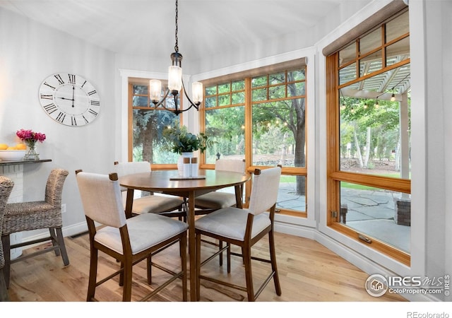 5424 Taylor Ln, Fort Collins, CO 80528 - dining space with light wood-type flooring, a chandelier, and healthy amount of natural light