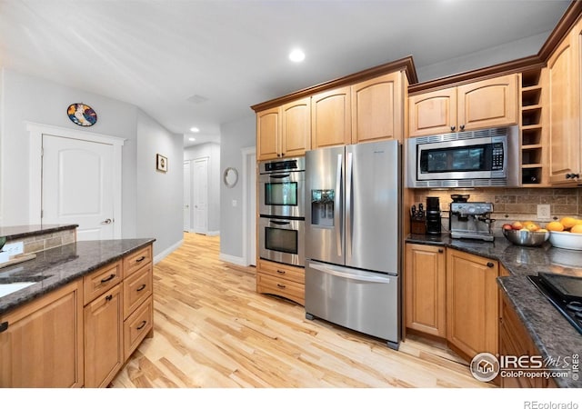 5424 Taylor Ln, Fort Collins, CO 80528 - kitchen featuring stainless steel appliances, decorative backsplash, light wood finished floors, recessed lighting, and dark stone counters