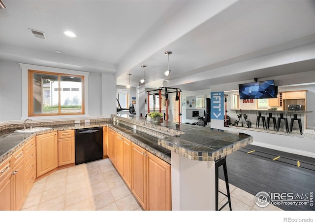 5424 Taylor Ln, Fort Collins, CO 80528 - kitchen with dishwasher, tile counters, a peninsula, a kitchen breakfast bar, and light brown cabinetry