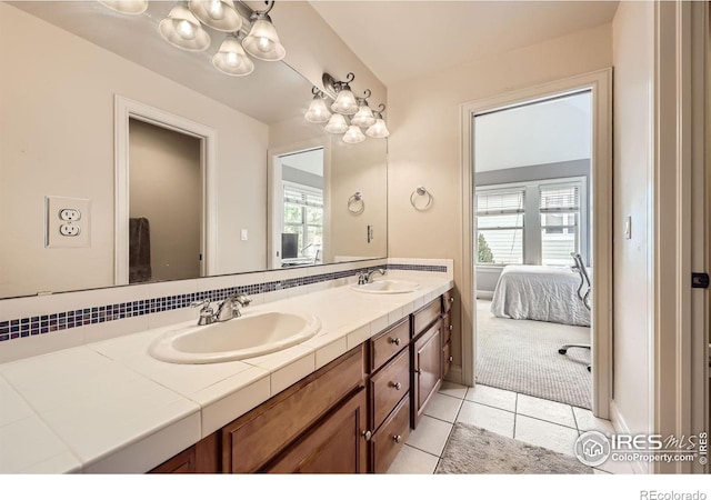 714 Skywalker Pt, Lafayette, CO 80026 - bathroom featuring ensuite bathroom, double vanity, healthy amount of natural light, and tile patterned floors