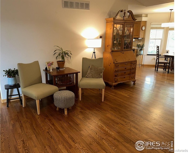 205 Timber Ridge Ct, Severance, CO 80550 - living area with dark wood-style floors and baseboards