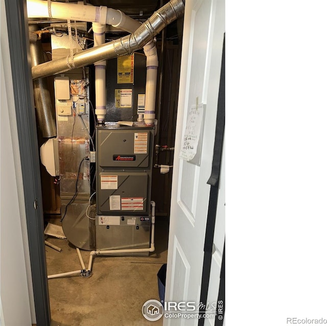 205 Timber Ridge Ct, Severance, CO 80550 - utility room with heating unit