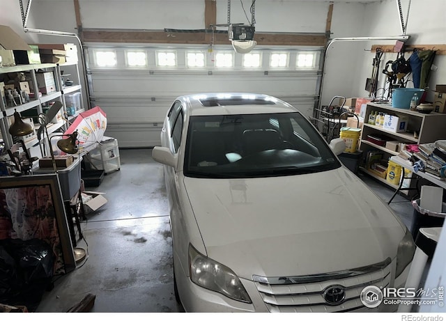 205 Timber Ridge Ct, Severance, CO 80550 - garage featuring a garage door opener