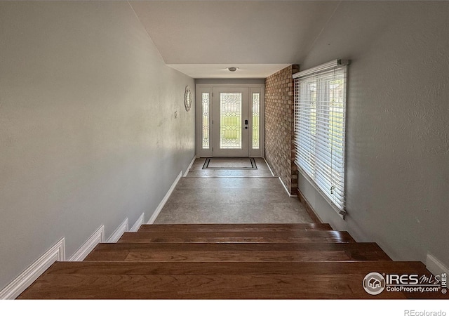 5004 Fox Hill Dr, Longmont, CO 80504 - stairway featuring baseboards and finished concrete flooring